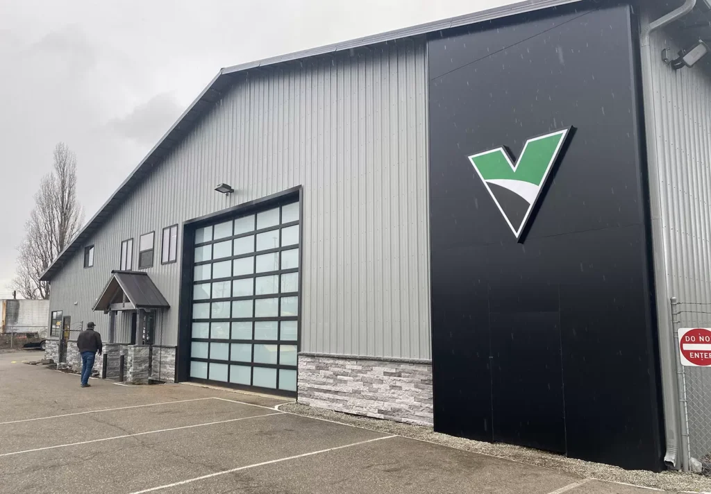 Vermeer Mountain West building in Tacoma, WA with an overcast PNW sky in the background.