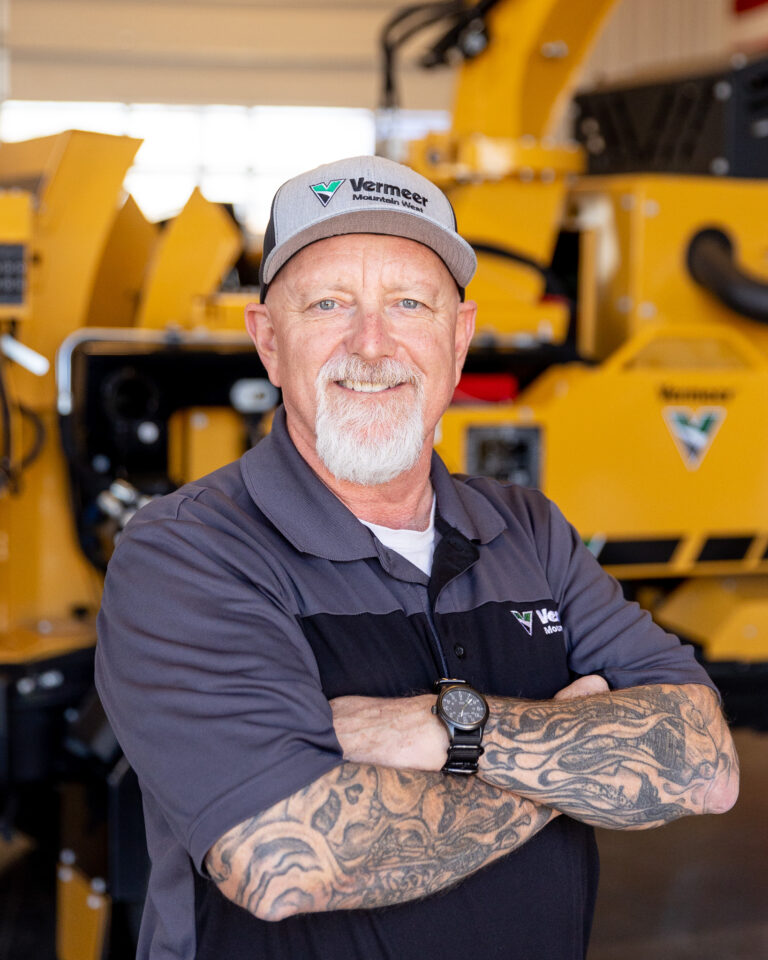 Ray Dickerson, Vermeer Environmental Sales Representative, standing in front of Vermeer machinery.