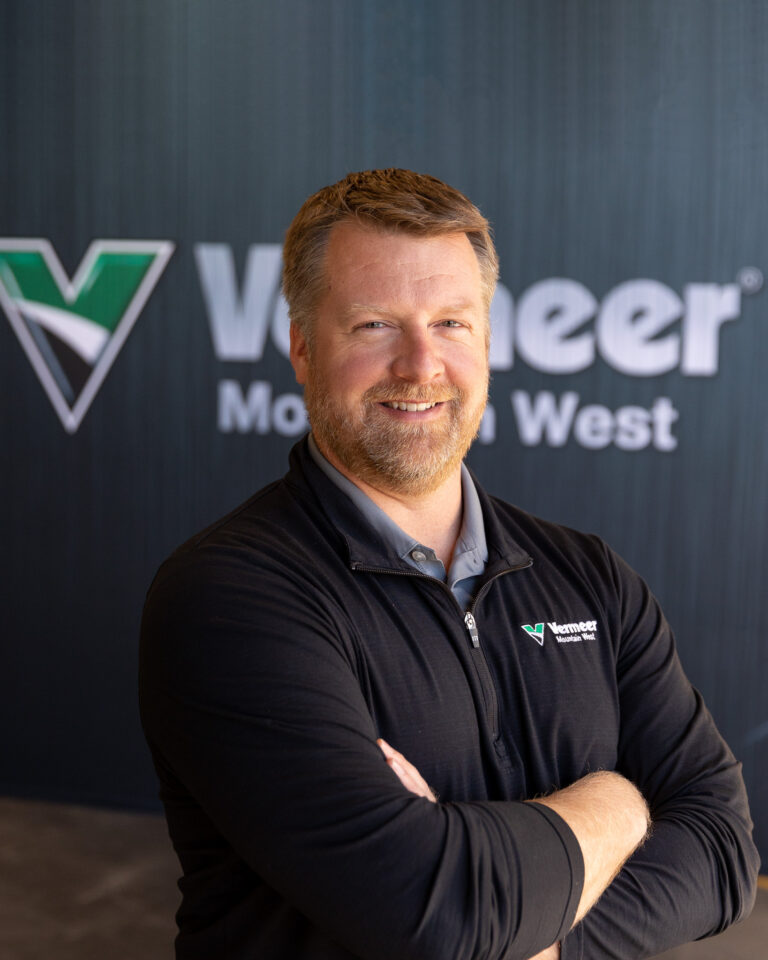 Austin Bonnema, Vermeer Vice President of Sales, standing in front of a Vermeer backdrop.