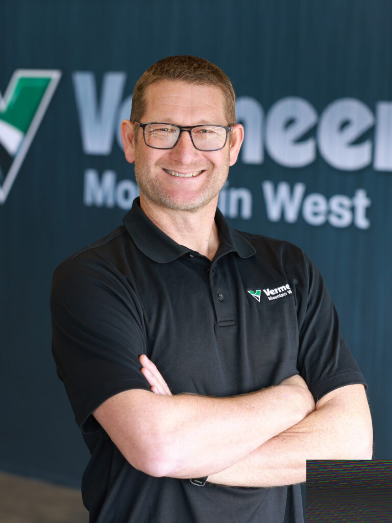 Mike Mortimer, Vermeer Branch Manager, standing in front of a black backdrop with the Vermeer logo.