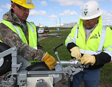 Sales rep and customer with Larson cable trailer