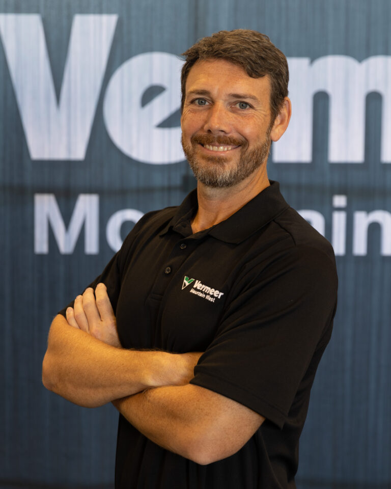 Scott Swaidner, Vermeer Branch Manager, standing in front of a black backdrop with the Vermeer logo.